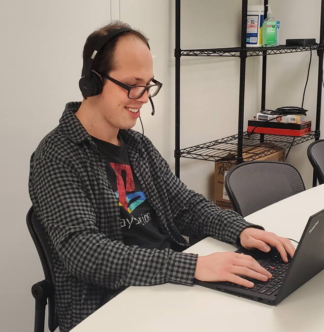 Virtual office staff working on laptop